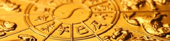 Golden zodiac wheel with Chinese characters and animal motifs